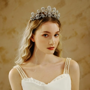 Close-up of a silver rhinestone skull crown on a model with elegant gothic styling