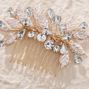 Golden bridal hair comb with alloy leaves and sparkling crystals for wedding hairstyles