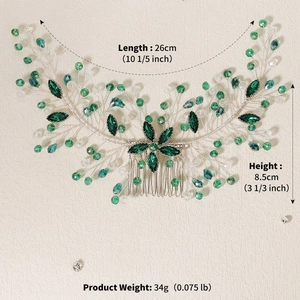 Detail of silver bridal hair comb with green crystals and measurement markings