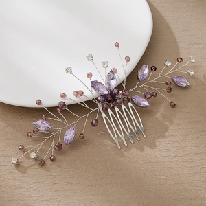 Detail of silver bridal hair comb with purple marquise crystals and beaded branches