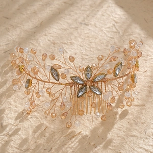 Elegant gold bridal hair comb with champagne crystals and rhinestone flowers for weddings