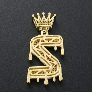 Detailed back view of iced out S-letter crown pendant showing honeycomb metal craft