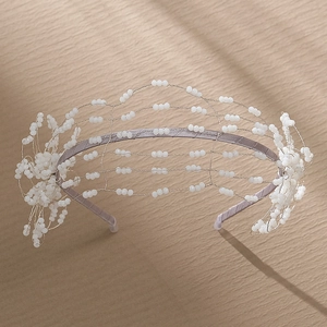 Exquisite white handmade beaded bridal headband featuring delicate floral wire craftsmanship