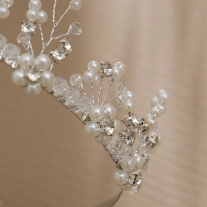 Elegant bridal headband featuring handmade pearls, faceted crystals and silver wire vines