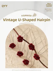 Detail of six vintage U-shaped hair pins featuring dark red velvet flowers on a branch