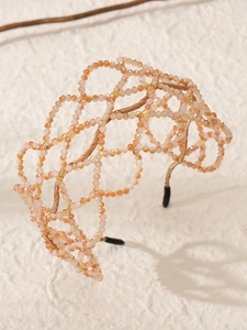 Detail of luxurious champagne crystal beaded mesh design on an elegant bridal headband