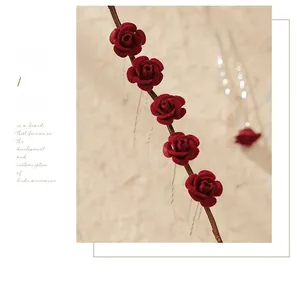 Set of five red flocked rose hair pins with U-shaped metal clips for bridal hairstyles