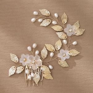 Elegant gold bridal hair comb with pearls and frosted floral leaf design for weddings