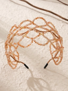 Detailed view of champagne beaded bridal headband with woven luxury crystal structure