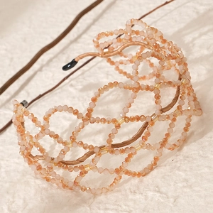 Handmade beaded bridal headband with luxury crystal mesh in apricot on a fabric base