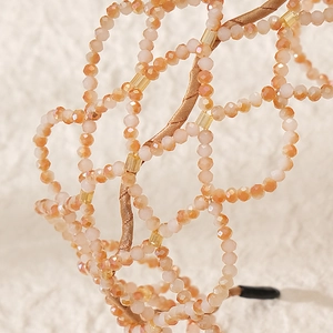 Handmade beaded bridal headband with champagne crystal petals and luxury mesh texture
