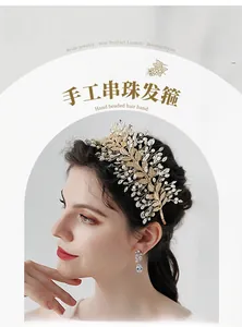 Detail showing handcrafted golden leaves and pearls on a bridal rhinestone headband