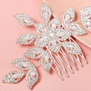 Close-up of floral silver hair comb with marquise crystals and white rhinestones