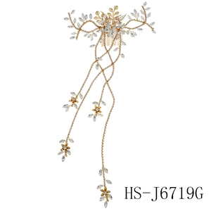Elegant gold bridal hair comb with rhinestone leaves and long tassel chain fringe