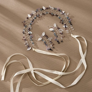 Detail of handmade bridal headband and earrings set with purple crystals and silk ribbons