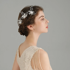 Detailed view of handmade bridal hair vine with silk flowers, pearls and crystal beads