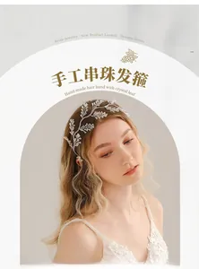 Detailed view of handmade bridal headband with crystal leaves and satin-wrapped wire