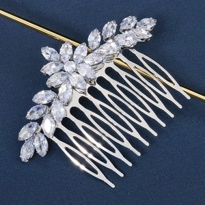 Detailed view of silver wedding hair comb with marquise cut zircons and leaf design
