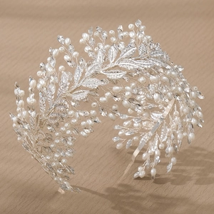 Handmade bridal headband with white pearls and rhinestones on silver floral leaves