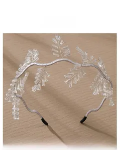 Detail view of handmade bridal headband with radiating crystal beads and silver wire