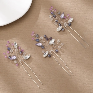 Detail of three handmade U-shaped hairpins with colorful crystal beads and silver wire