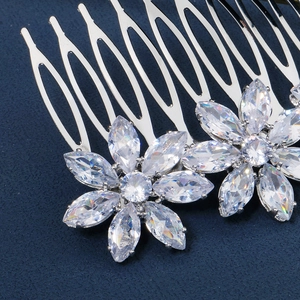 Macro shot of silver hair comb with marquise-cut crystals in a floral bridal design