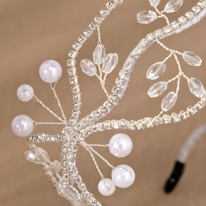 Handmade bridal headband with white crystals and pearls on silver wire vine design