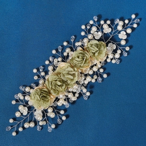 Handmade bridal headpiece with green flowers, pearls and crystals on silver wire