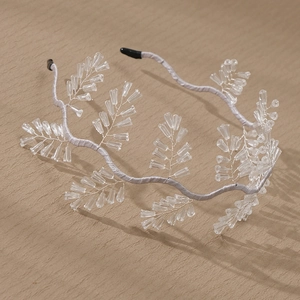 Exquisite bridal headband featuring handmade crystal beaded branches and silver wavy base