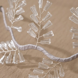 Exquisite bridal headband with handmade crystal beads and silver wire leaf pattern