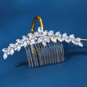 Macro shot of silver bridal hair comb featuring marquise cut cubic zirconia leaf details