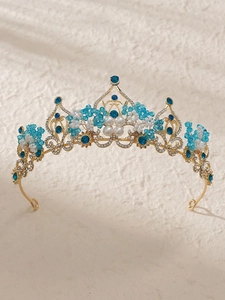 Detail of baroque bridal crown with golden metal, sky blue beads and white pearls