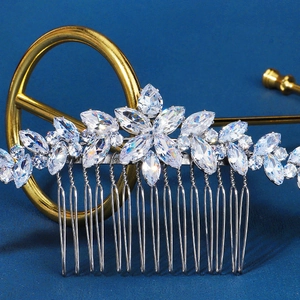Detailed macro view of zircon hair comb showing marquise-cut crystals and silver base