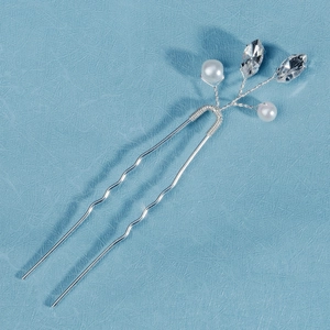 Detail of silver bridal hair pin with handmade wire pearls and crystals for wedding