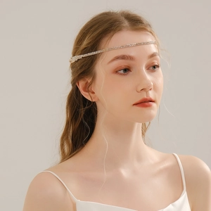 Detail view of double-row rhinestone bridal headpiece on model for elegant wedding styling