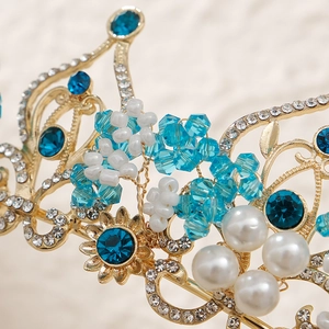 Baroque bridal crown with blue rhinestones and pearls on a gold-plated floral frame