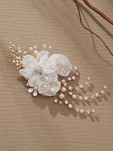 Detailed view of handmade mesh flower hair clip with pearls and crystal wire accents