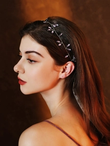 Detailed view of handmade bridal headband with purple crystals on silver wire