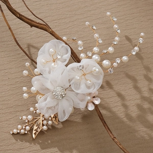 Handmade white mesh flower hair clip with pearls and gold leaves for bridal styling