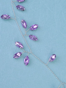 Macro detail of handmade purple marquise crystal bridal headband with silver wire work