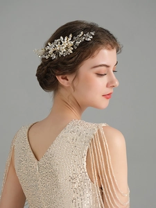 Detail of handmade pearl hair comb for bridal wedding with champagne gold wire and crystal