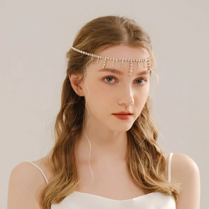 Close-up of bridal rhinestone head chain with cascading fringe tassels and silver crystals