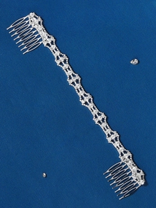 Detailed close-up of a long silver rhinestone hair comb chain with dual combs for weddings