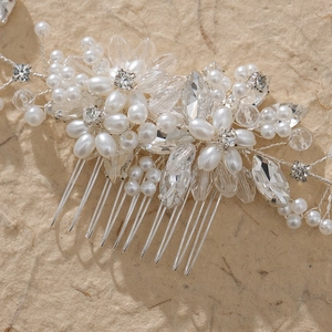 Handmade bridal hair comb with elegant white pearls and sparkling crystals for wedding
