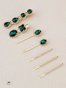Detailed set of seven emerald green crystal hair clips and gold rhinestone bobby pins