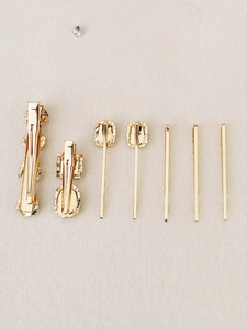 Detailed back view of a 7-piece gold-plated rhinestone hair clip set showing clip mechanism