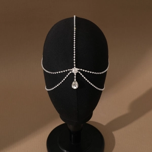 Elegant silver bridal headpiece with sparkling rhinestones and teardrop crystal pendant