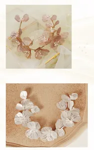 Detailed macro view of handmade gold and silver wire woven flower headbands with pearls