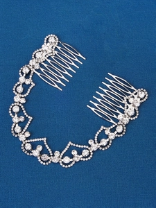 Close-up of silver bridal hair chain with sparkling rhinestones and heart-shaped patterns