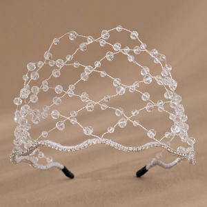 Detailed close-up of handmade bridal headband with mesh wire and sparkling crystals